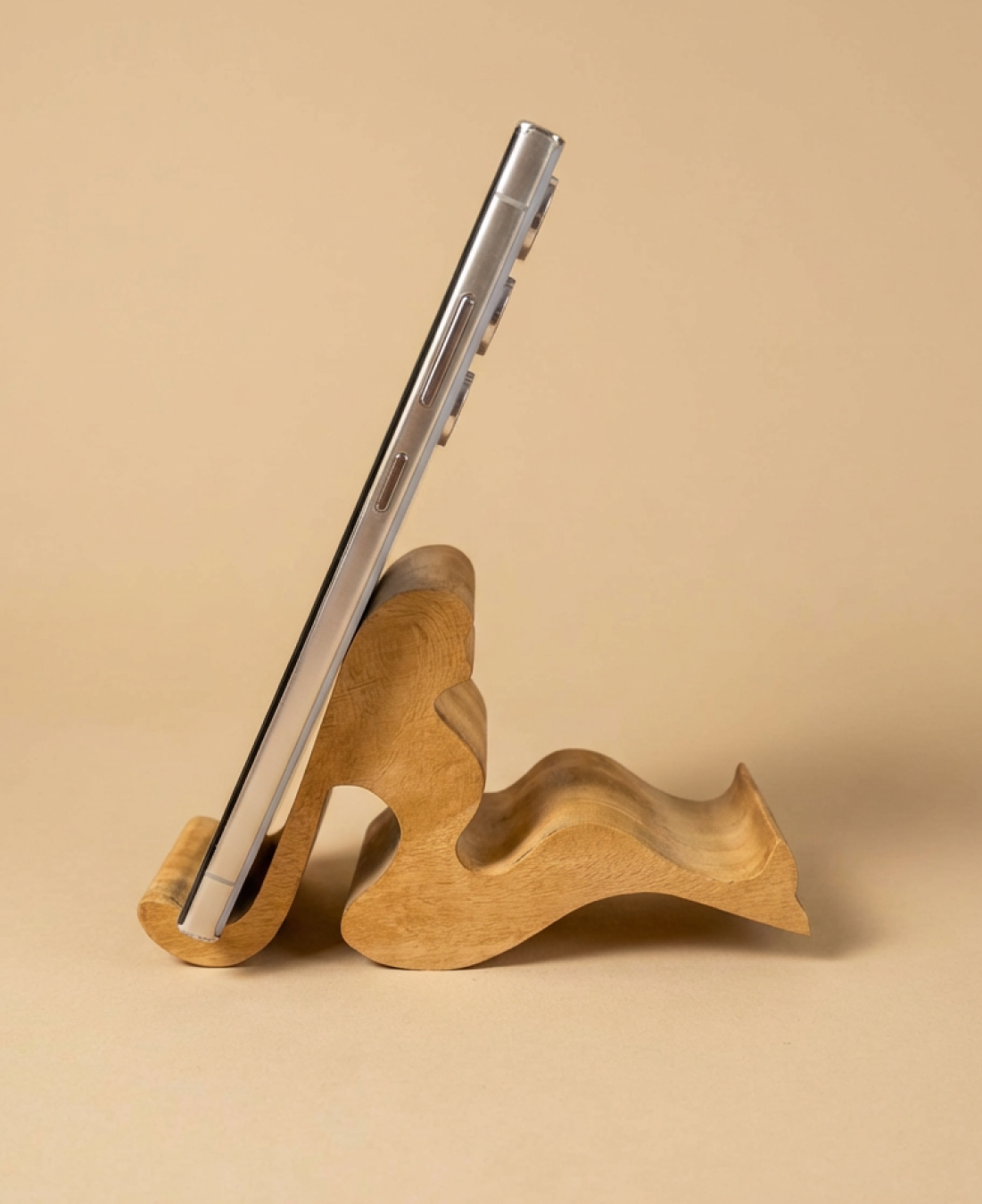 A handcrafted abstract wooden sculpture celebrating feminine form through smooth curves and minimalist design.