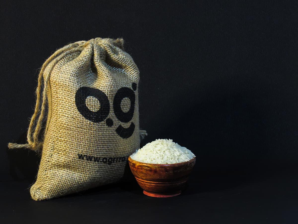 best organic basmati rice white, best organic white basmati rice, best organic rice, best organic basmati rice in a wooden bowl with eco friendly jute potli packaging filled with organic basmati rice. Order now from agrrro.