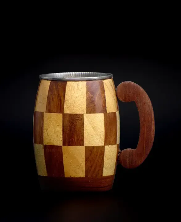 this is the beautiful and best handmade wooden coffee mug with stainless steel inside. It is handcrafted by the best artisans and engraved by hand. It has a checked design to make it beautiful and elegant. By the best handcrafted wooden coffee mug on www.agrrro.com.